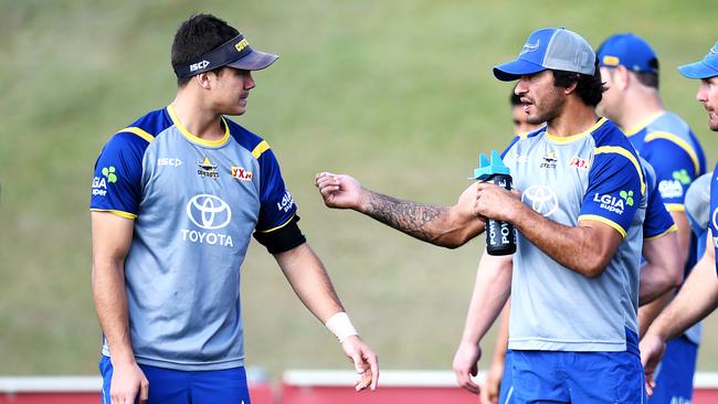 (L-R) Jake Clifford and Johnathan Thurston talk during North Queensland Cowboys training at 1300Smiles Stadium. Picture: Alix Sweeney