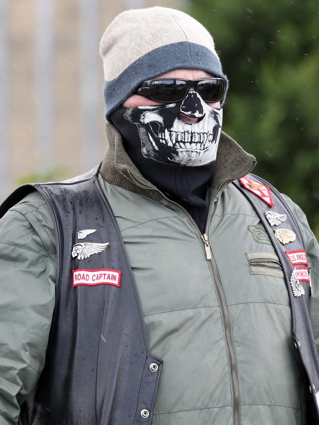 One wore a vest and skull bandana to cover his face.