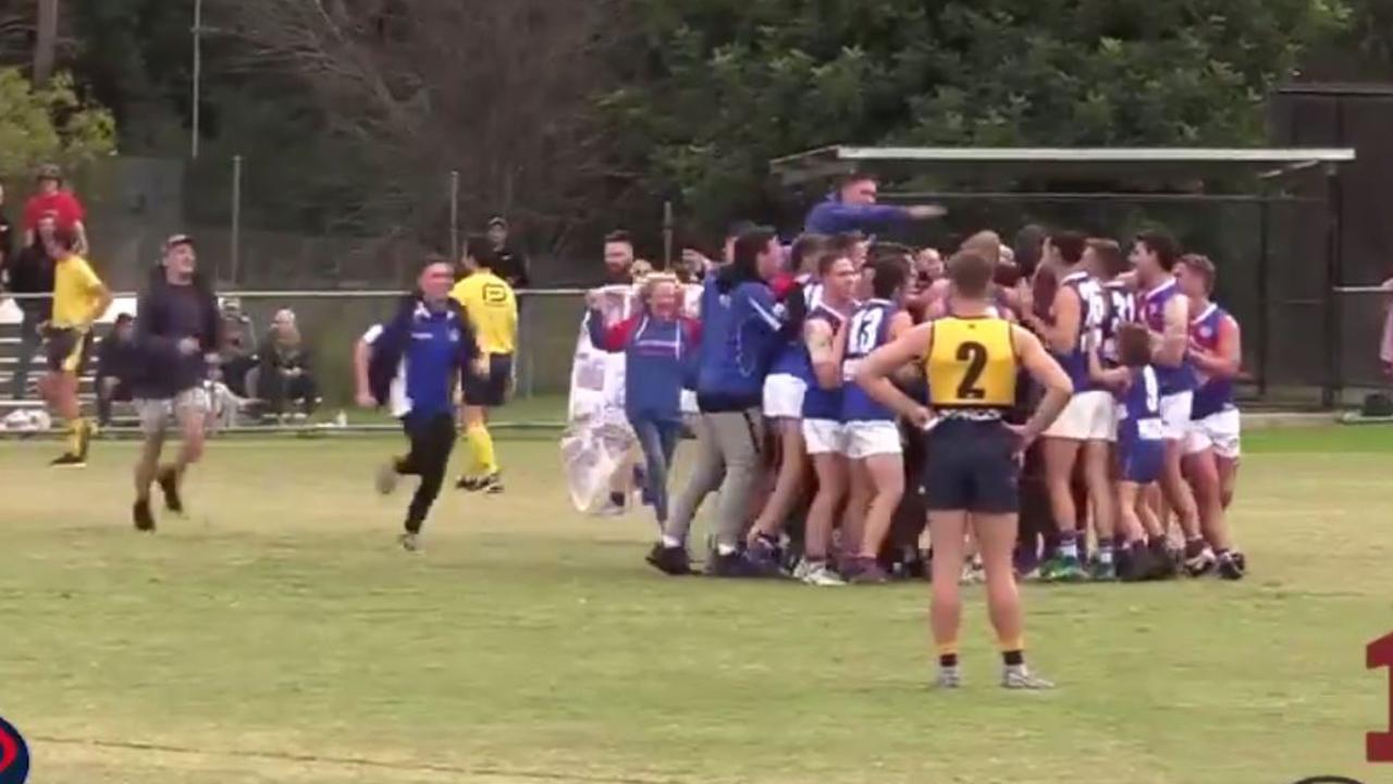 Fans ran onto the ground as Shane Harvey kicked his 1000th major in local footy.