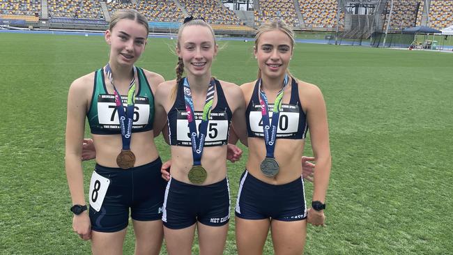 The 800m champion Emma Fryga, middle, alongside Charlize Heathcote, left, and Abbie Heggarty.