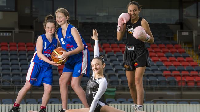 Looking to the Brisbane 2032 Olympics are (from left) Sharna O'Neil and Emmy Reimann of Toowoomba Mountaineers, Amelie Taylor of Allstar Gymnastics and Lekaysha Woodbridge of Smithy's TGW Gym at Clive Berghofer Stadium. Picture: Kevin Farmer