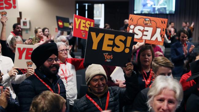 Delegates hold yes cards indicating support for the Indigenous voice to parliament. Picture: NCA NewsWire / David Crosling