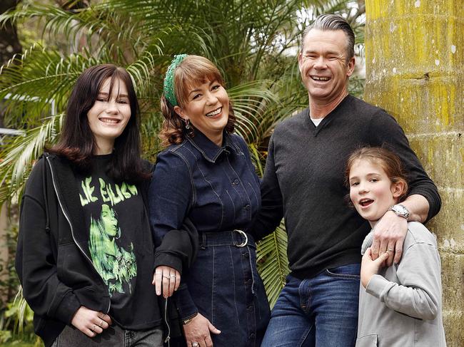 Singer Phil Burton at home with his wife Justine, daughter Ash and son Xavier. Picture: Sam Ruttyn