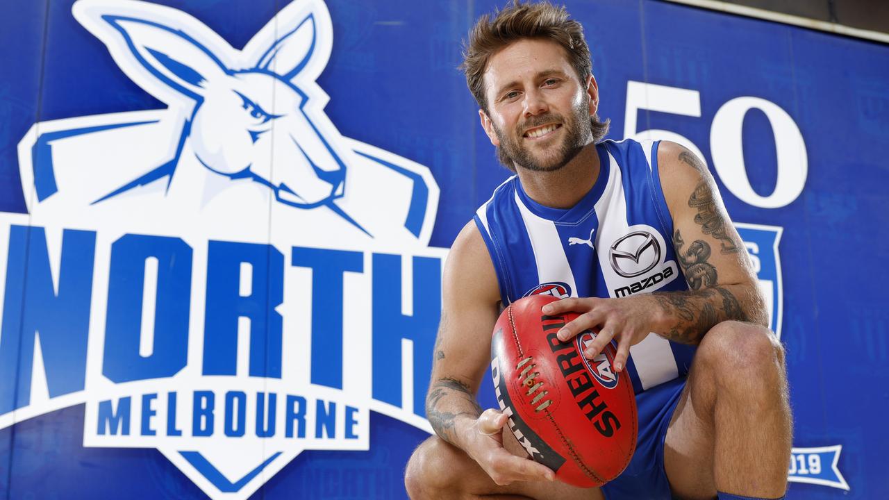 Caleb Daniel tries on his new colours after being traded to North Melbourne from the Western Bulldogs. Picture: Michael Klein