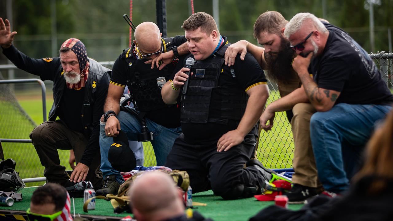 Proud Boy organisers lead in a prayer in front of several hundred people gathered at Delta Park in Portland, Oregon on September 26. Picture: Maranie R Stabb/AFP