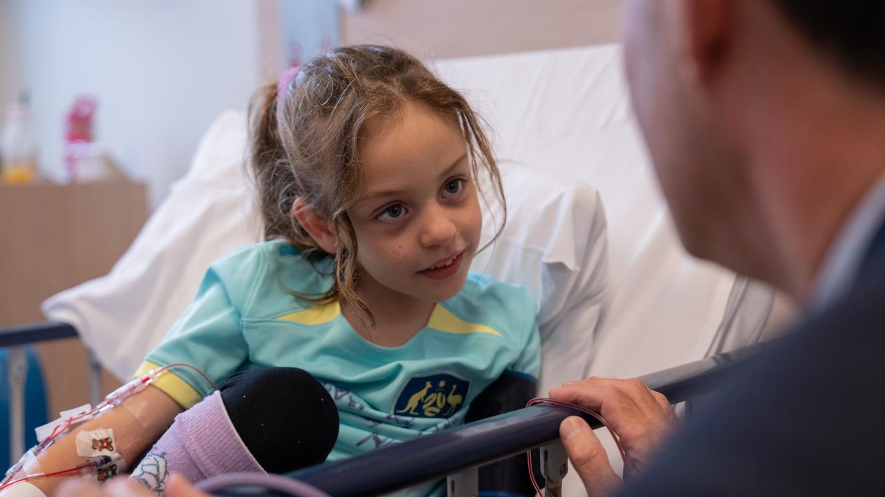 Zara, 6, chats to her doctor Professor Michael Fahey at Monash Children’s Hospital. Picture: Supplied