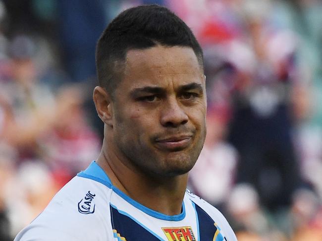 Jarryd Hayne of the Titans gestures after accidentally kicking the ball into touch which then allowed the Roosters to get possession, score and win the game during the NRL Round 26 rugby league match between the Sydney Roosters and Gold Coast Titans at the Allianz Stadium in Sydney, Saturday, September 2, 2017. (AAP Image/David Moir) NO ARCHIVING, EDITORIAL USE ONLY