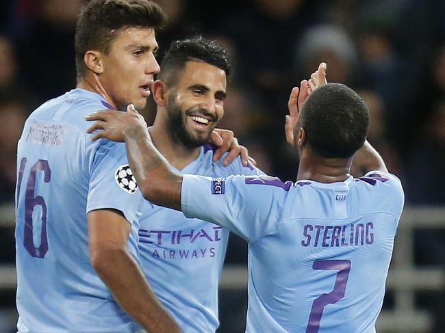 Manchester City's Riyad Mahrez, center, celebrates after scoring the opening goal during the Group C Champions League soccer match between Manchester City and FC Shakhtar Donetsk in Kharkiv, Ukraine, Wednesday, Sept. 18, 2019. (AP Photo/Efrem Lukatsky)