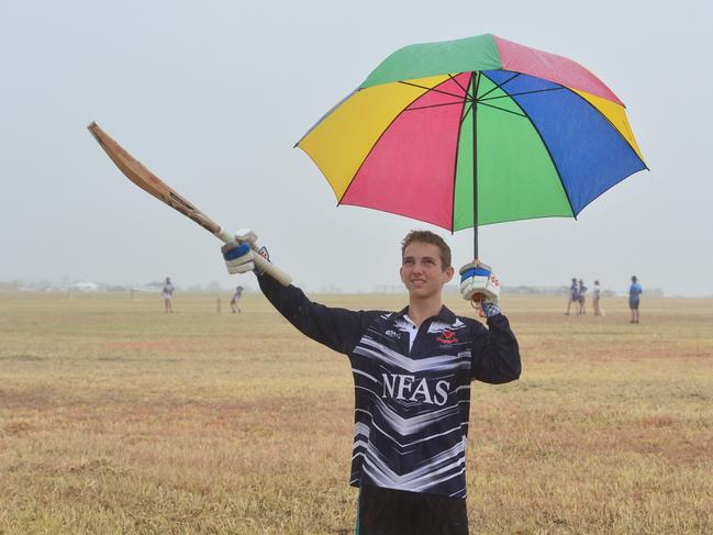 Goldfield Ashes at Charters Towers. Jake Barwick, 14, from Townsville doesn't let the rain stop him playing for the Norths Father and son team. Picture: Evan Morgan