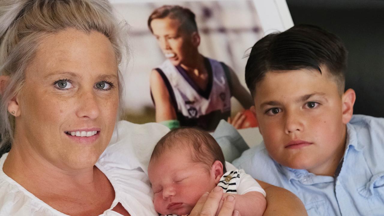 Kristie Ward with her newborn baby, Tarkyn, son, Braxton, and a framed photo of her late son, Elihjohn. Picture: Mark Wilson