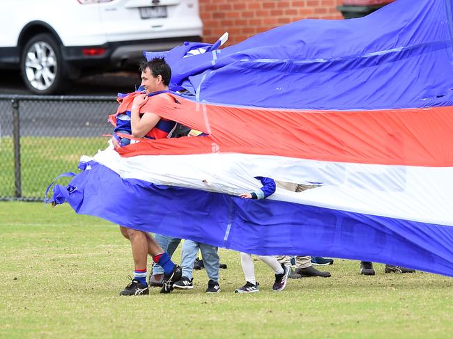 BFL: Queenscliff v Geelong Amateur. No 20 Tom Limb for Queenscliff running through the Flag.