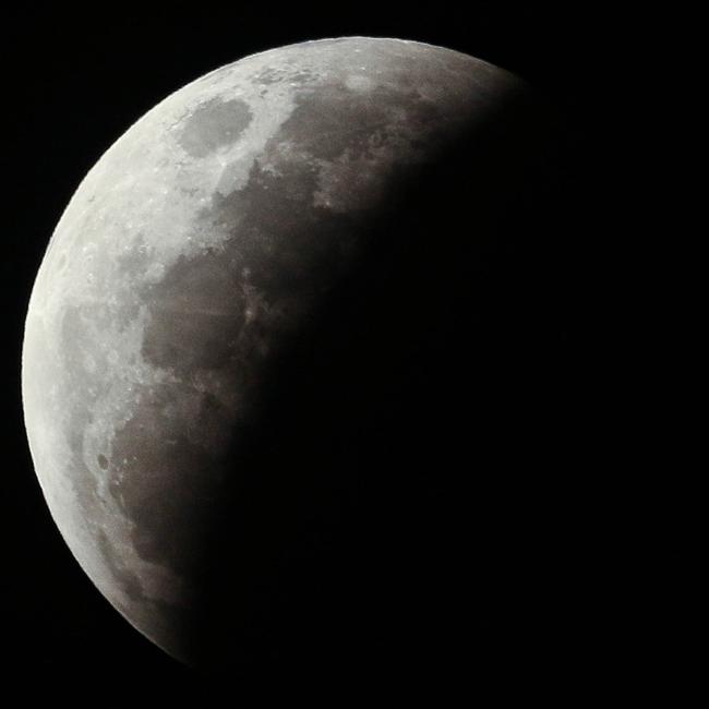 The super blood full moon seen over Darwin on Wednesday night. Pictures: Glenn Campbell