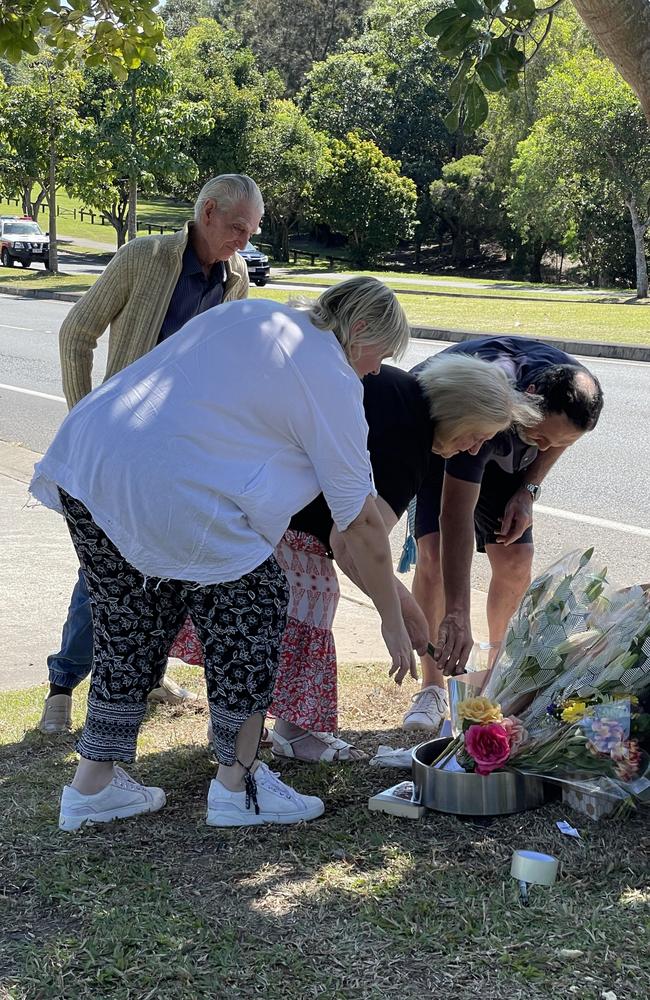 Neighbours adjacent to the crash site comfort the family. Picture: Sam Stolz