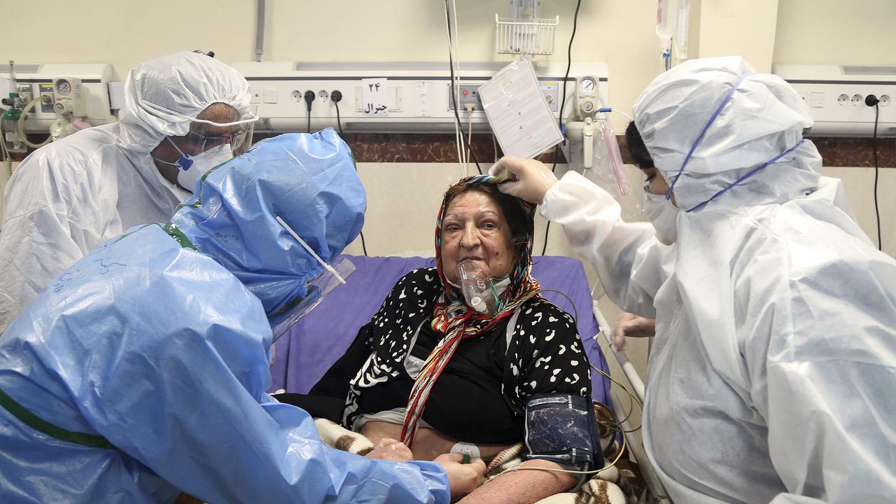 Medics treat a patient infected with the coronavirus at a hospital in Tehran. Picture: AP/Mohammad Ghadamali