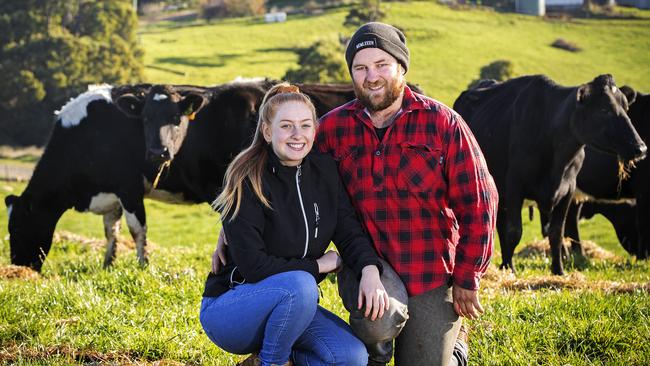 Aaron Ferguson (with partner Gabby Mathews) is a dairy farmer at Calder. Picture: Chris Kidd