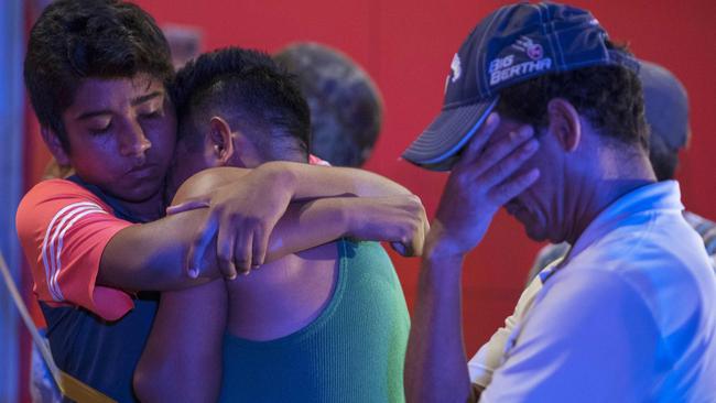 People react outside a bar where 23 people were killed by a fire in Coatzacoalcos, Veracruz. Picture: AFP