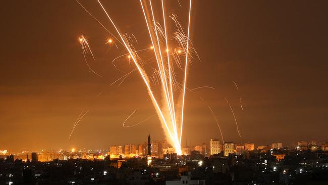 Rockets light up the night sky as they are fired towards Israel from Beit Lahia in the northern Gaza Strip on May 14. Picture: AFP