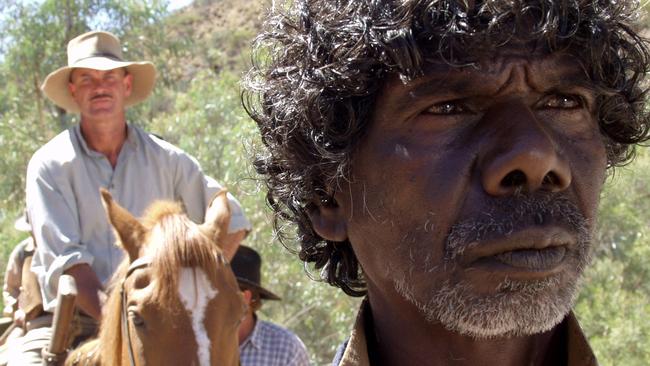 Actor David Gulpilil with Gary Sweet in scene from film 