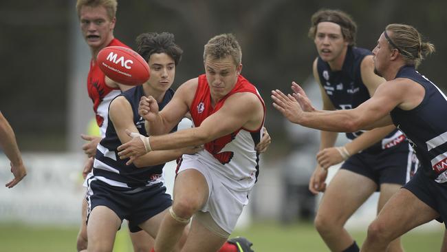 Flagstaff Hill's Bradley Patterson under pressure against Noarlunga in April. Picture: AAP Image/Dean Martin