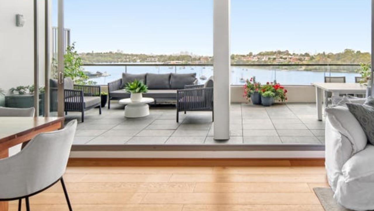 The open-plan living areas open to a huge terrace with amazing 180-degree water views.