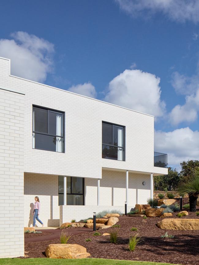 Most of the properties in the beach suburb are clad, but Sandy wanted a brick exterior. Photos: Jack Lovel