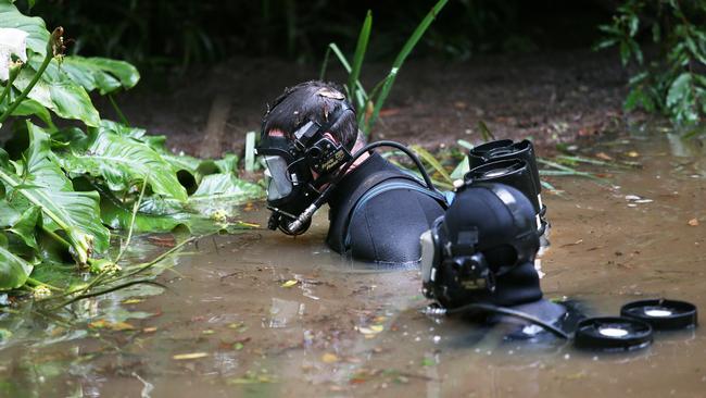 Police divers search a dam in the search for William’s remains. Picture: Peter Lorimer