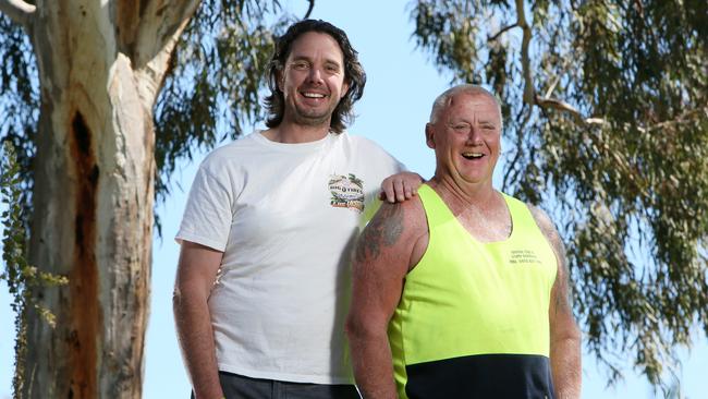 Pride of Australia. Nigel Hardy and Geoff Pinch catch up after the Birdsville track rescue, in the Oaklands Wetland Reserve, S.A. Nigel Hardy (White Shirt) pulled his friend Geoff Pinch (Fluro top)  rom boiling mud on the Birdsville track. (AAP/Emma Brasier)