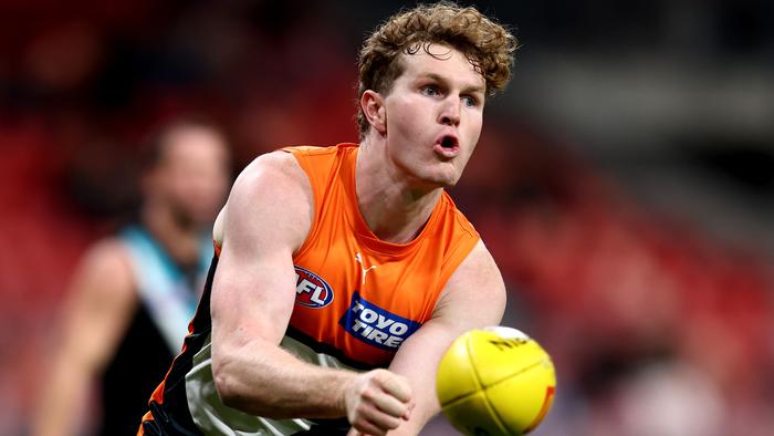 SYDNEY, AUSTRALIA - JUNE 16: Tom Green of the Giants handballs to a team mate during the round 14 AFL match between Greater Western Sydney Giants and Port Adelaide Power at ENGIE Stadium, on June 16, 2024, in Sydney, Australia. (Photo by Brendon Thorne/AFL Photos/via Getty Images)