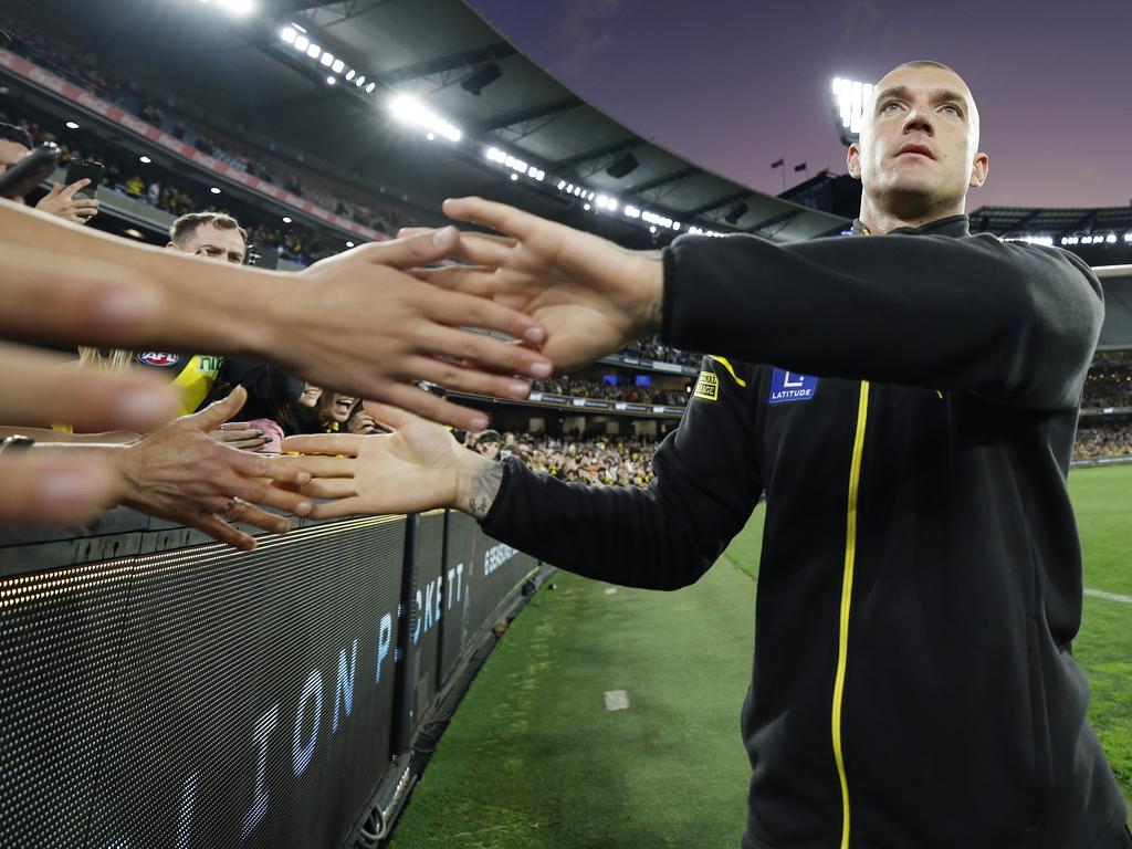 Dustin Martin waves to the crowd during a lap of honour at the MCG. Picture: Michael Klein