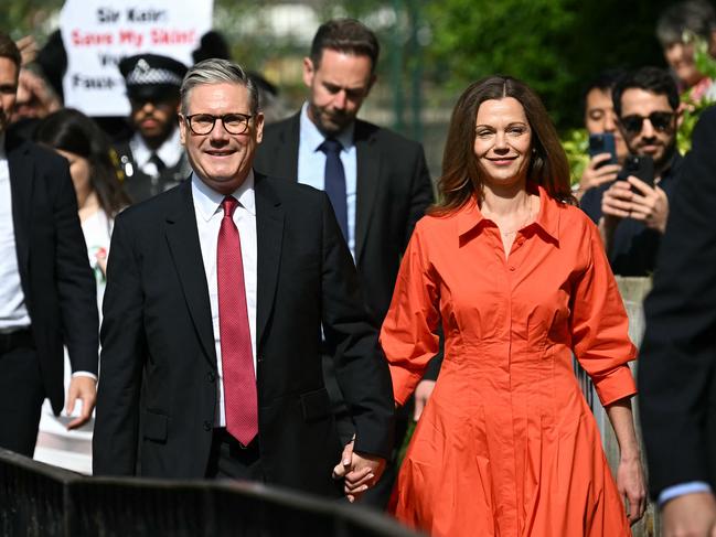 Britain's opposition Labour Party leader Keir Starmer and his wife Victoria arrive to cast their votes at a polling station in London. Picture: AFP