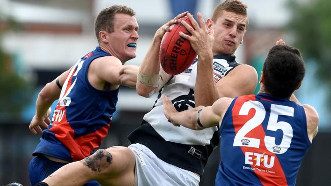 Liam Jones out-marks two opponents while playing for the Northern Blues. Picture: Kylie Else