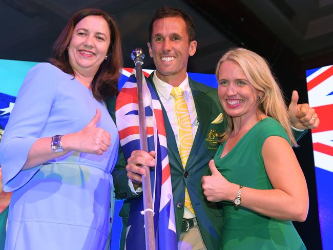 Premier Annastacia Palaszczuk (left) with hockey captain and opening ceremony flagbearer Mark Knowles and Commonwealth Games Minister Kate Jones. Picture: Tracey Nearmy/AAP