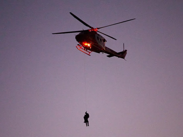 Two men and a woman were winched to safety at Second Valley on Tuesday in fading light. Picture: Matt Loxton