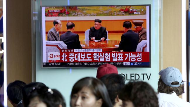 People watch a TV news program at Seoul Railway Station showing North Korean leader Kim Jong-un. Picture: AP