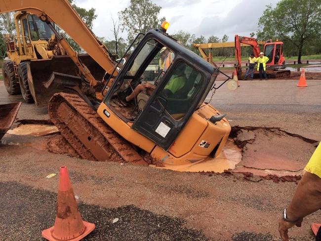 An excavator sunk at Borroloola while carrying out work on the road.