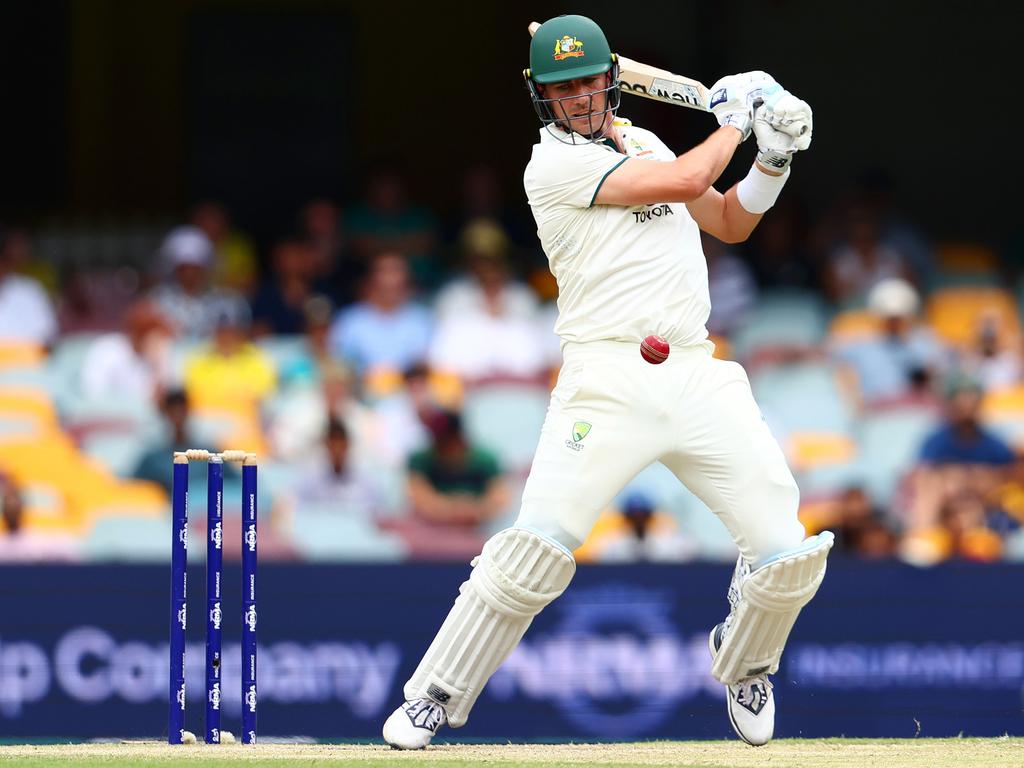 Pat Cummins bats during day five of the Third Test match in the current series between Australia and India at The Gabba on December 18 in Brisbane, Australia. Picture: Chris Hyde/Getty Images