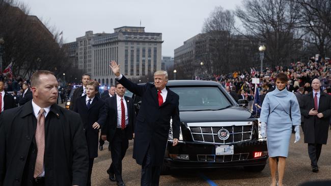 President Donald Trump and first lady Melania Trump walk near the White House in the inaugural parade. Picture: AP