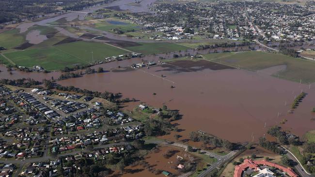 WEEKEND TELEGRAPH SPECIALJULY 8, 2022.WARNING POOL POSITION - MUST BE SHAREDNSW Premier Dominic Perrottet surveys the floods in the Hunter Region in a chopper this morning with Minister for Emergency Services and Resilience and Minister for Flood Recovery Steph Cooke. Pictured is flooding in and around Singleton. Picture: David Swift