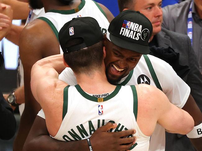 ATLANTA, GEORGIA - JULY 03: Bobby Portis #9 of the Milwaukee Bucks hugs Pat Connaughton #24 after the team's series win against the Atlanta Hawks in Game Six of the Eastern Conference Finals at State Farm Arena on July 03, 2021 in Atlanta, Georgia. NOTE TO USER: User expressly acknowledges and agrees that, by downloading and or using this photograph, User is consenting to the terms and conditions of the Getty Images License Agreement.   Kevin C. Cox/Getty Images/AFP == FOR NEWSPAPERS, INTERNET, TELCOS & TELEVISION USE ONLY ==