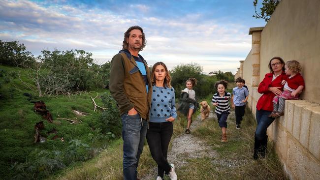 25/06/2018Niek Van Santen, his wife Marcelly and 11-year-old daughter Talia with dog Basil, neighbour Helena Smith with Evelince (1) and boys Axel (7, stripped), Toki (7, light blue) and Daniel (7, dark top).pic Colin Murty The Australian