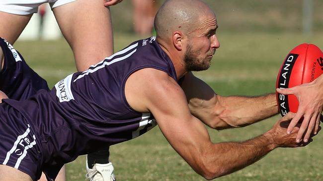 EFL Division 2 2022: Templestowe v South Belgrave at Templestowe Reserve: Toby Ryan of Templestowe dives with the ball on Saturday April 23, 2022, in Templestowe, Victoria AustraliaPicture: Hamish Blair