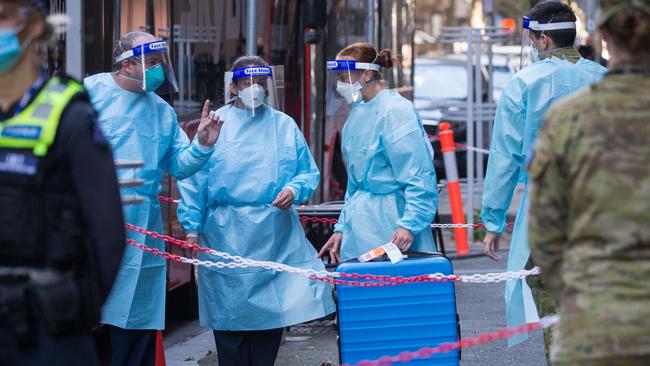 Authorities outside hotel quarantine in Melbourne on April 8. The case recorded in Victoria on Tuesday morning involved a Victorian who returned to Australia through hotel quarantine in South Australia. Picture: Getty