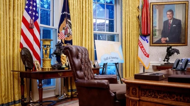 A gold-plated replica of the FIFA World Cup trophy sits on a side table in the Oval Office, accompanied by a golden urn, framed photos, and other decorative items. Picture: Getty Images