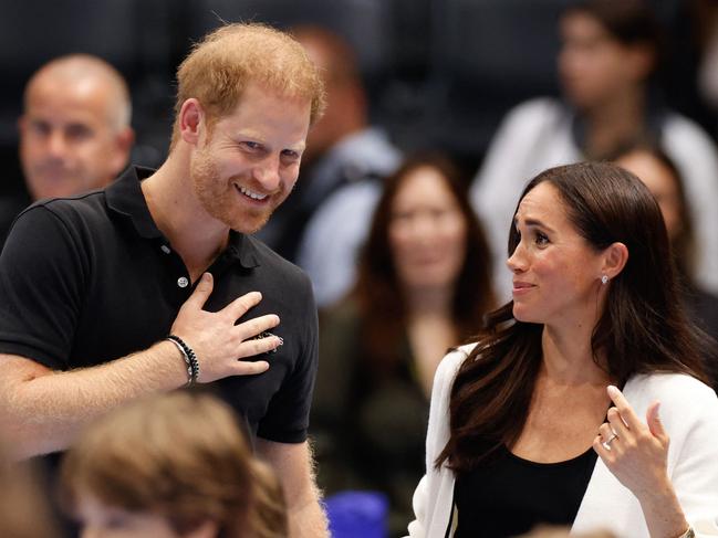 The Duchess of Sussex was spotted wearing just her wedding band without her engagement ring. Picture: AFP