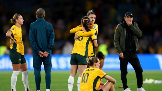 Hayley Raso of Australia is consoled by Steph Catley after the semi-final loss. (Photo by Cameron Spencer/Getty Images)