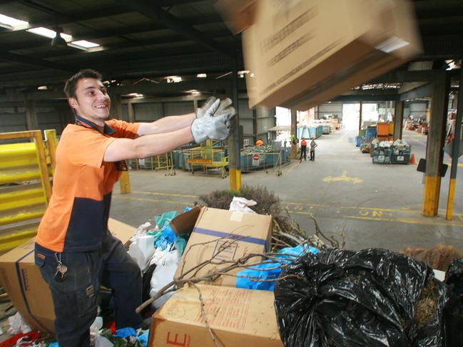 Geelong Recovery Resource Centre                                    Nth Geelong Matt Sobko (GRRC worker) cleans up a skip load a rubbish