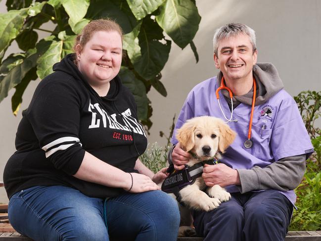 Maddie Powell with her dog, Miles, 12 weeks old, and vet, Dr. Chris McIver at Baptist Care in Adelaide, Sunday, Aug. 16, 2020. Picture: MATT LOXTON