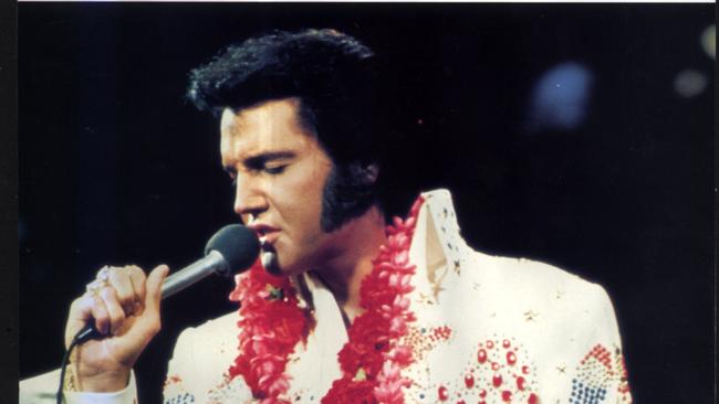 Singer Elvis Presley on stage during concert in Hawaii 1973. 1970s