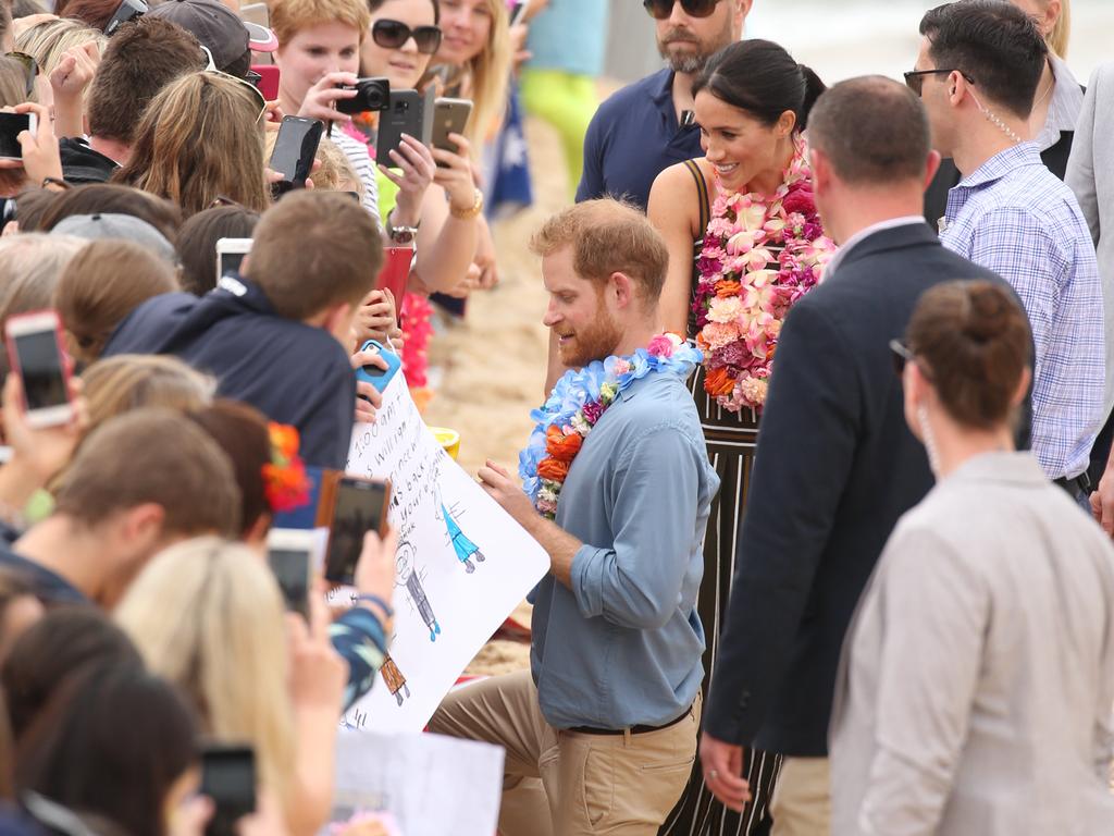 DAILY TELEGRAPH - Pictured is the Duke and Duchess of Sussex, Prince Harry and wife Meghan at Bondi Beach today on their Royal tour of Australia. Picture: Tim Hunter