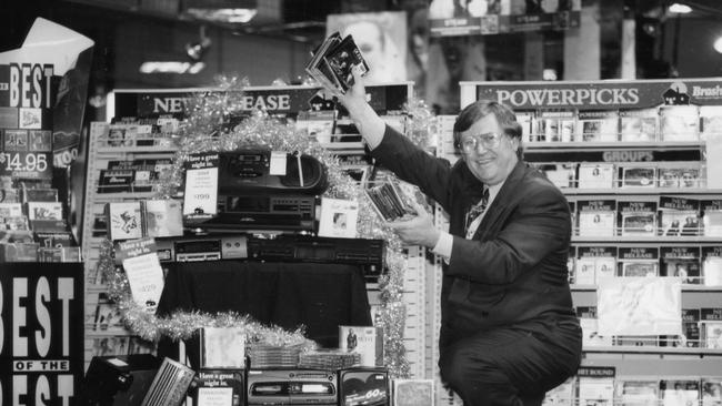 Retail Traders Association executive director David Shetliffe among the CDs and CD players on sale for Christmas at a Brashs store in 1994.